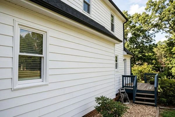 Vinyl siding restored after soft-wash house washing in Raleigh NC